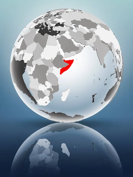 Somalia on globe with translucent oceans on shiny surface. 3D illustration.