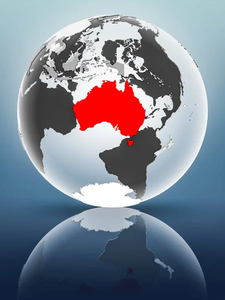 Australia on globe with translucent oceans on shiny surface. 3D illustration.
