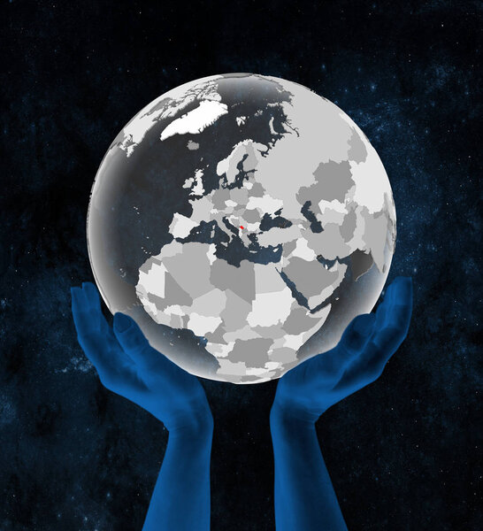 Kosovo on translucent globe in hands in space. 3D illustration.