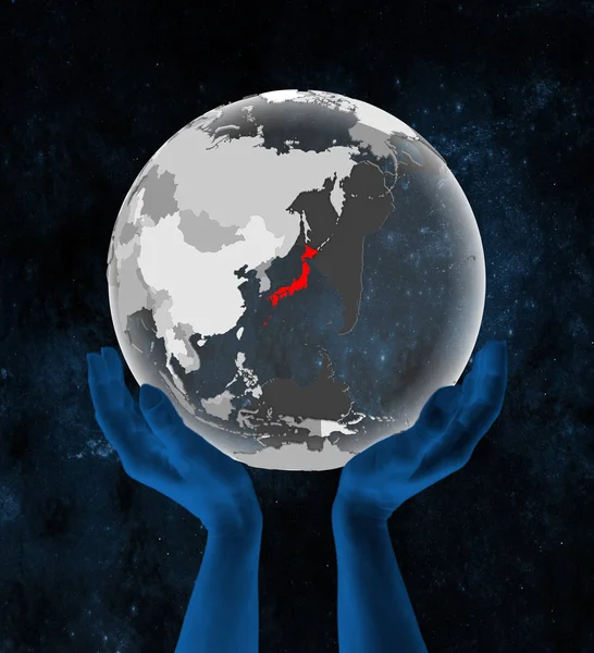 Japan on translucent globe in hands in space. 3D illustration.