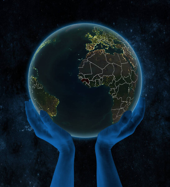 Guinea on night planet Earth with visible country borders in hands in space. 3D illustration.