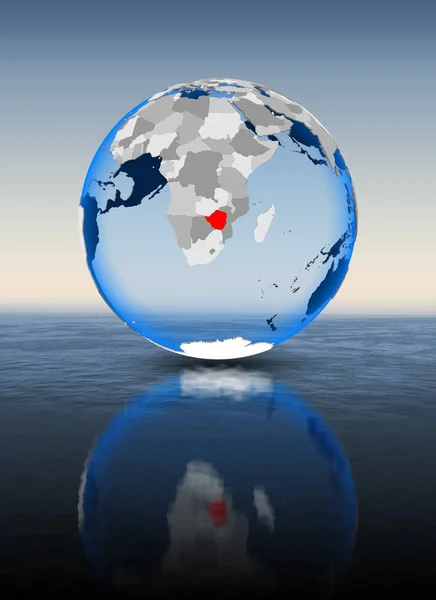 Zimbabwe In red on globe floating in water. 3D illustration.