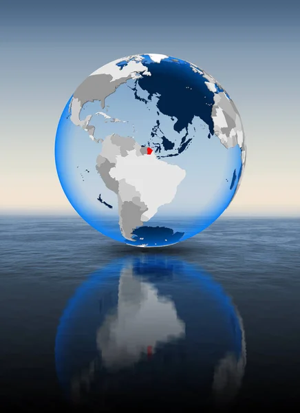 French Guiana In red on globe floating in water. 3D illustration.