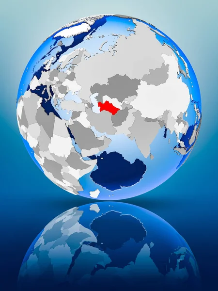 Turkmenistan on political globe standing on reflective surface. 3D illustration.