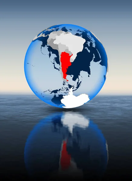 Argentina In red on globe floating in water. 3D illustration.