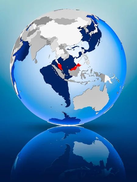 Malaysia on political globe standing on reflective surface. 3D illustration.