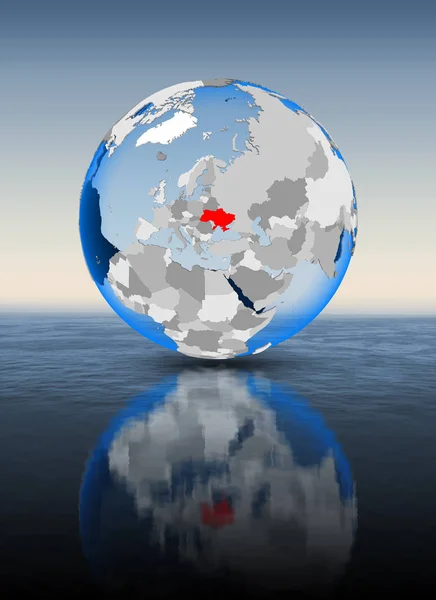 Ukraine In red on globe floating in water. 3D illustration.