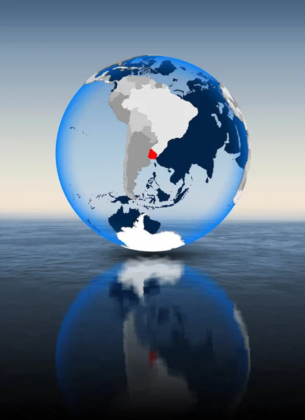Uruguay In red on globe floating in water. 3D illustration.