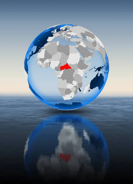 Central Africa In red on globe floating in water. 3D illustration.