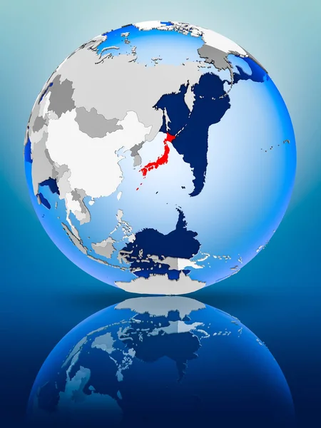 Japan on political globe standing on reflective surface. 3D illustration.