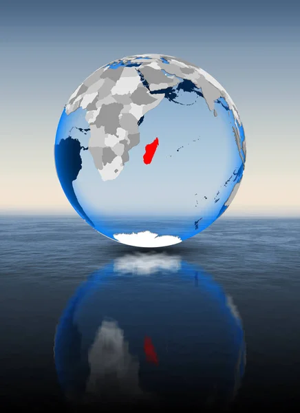 Madagascar In red on globe floating in water. 3D illustration.