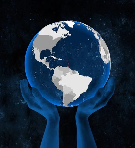 Caribbean on translucent blue globe held in hands in space. 3D illustration.