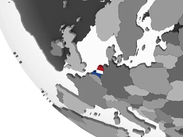 荷兰在灰色政治地球仪与嵌入的旗子 — 图库照片