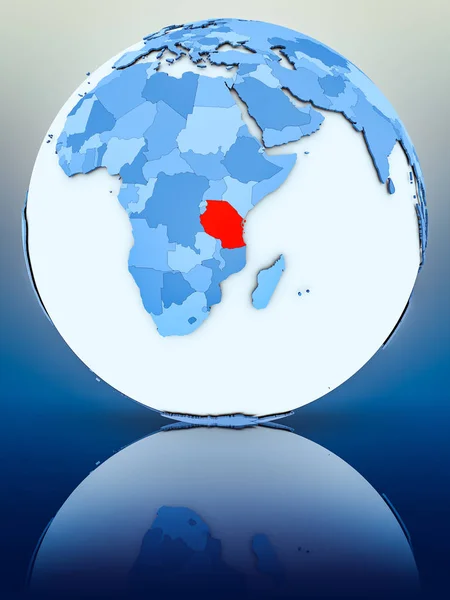 Tanzania on blue globe on reflective surface. 3D illustration.