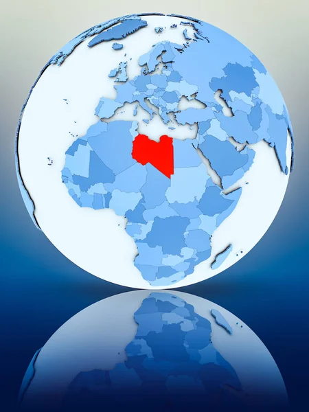 Libya on blue globe on reflective surface. 3D illustration.
