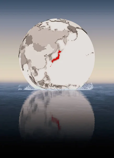 Japan In red on globe floating in water. 3D illustration.
