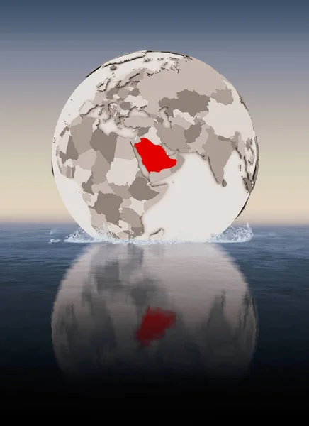 Saudi Arabia In red on globe floating in water. 3D illustration.