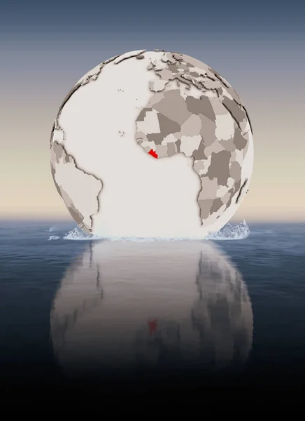 Liberia In red on globe floating in water. 3D illustration.