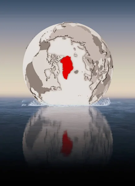 Greenland In red on globe floating in water. 3D illustration.