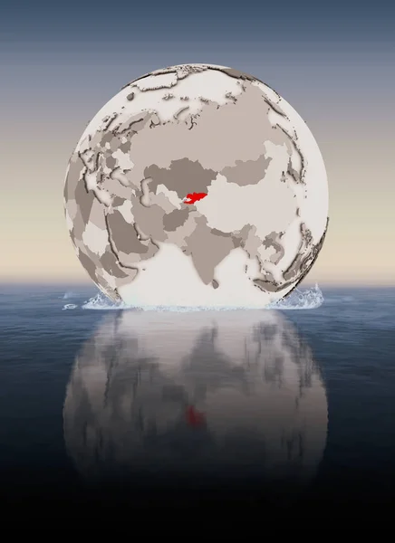 Kyrgyzstan In red on globe floating in water. 3D illustration.