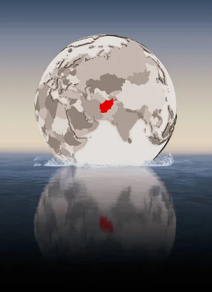 Afghanistan In red on globe floating in water. 3D illustration.