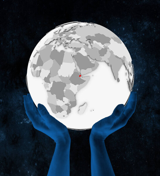 Djibouti In red on white globe held in hands in space. 3D illustration.