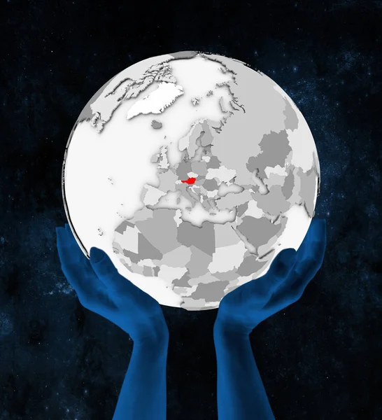 Uzayda Elinde Avusturya Içinde Kırmızı Beyaz Küre Üzerinde Tutulan Çizim — Stok fotoğraf