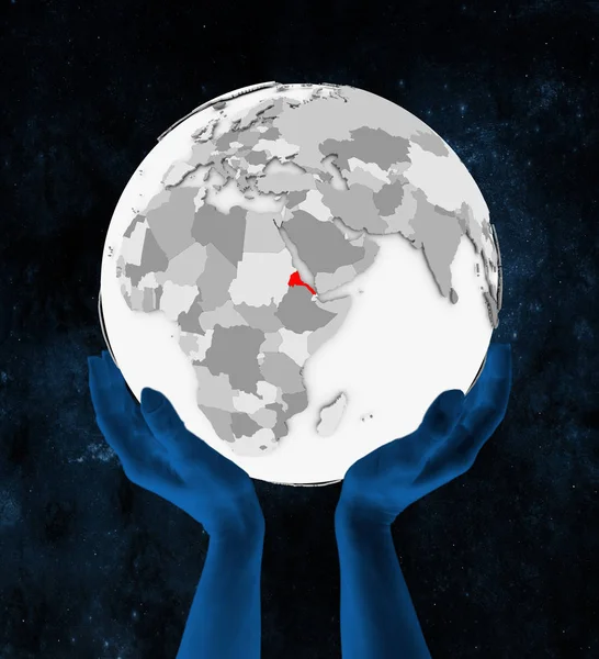 厄立特里亚以红色在白色地球手在空间举行 — 图库照片