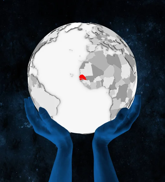 塞内加尔以红色在白色地球手在空间举行 — 图库照片