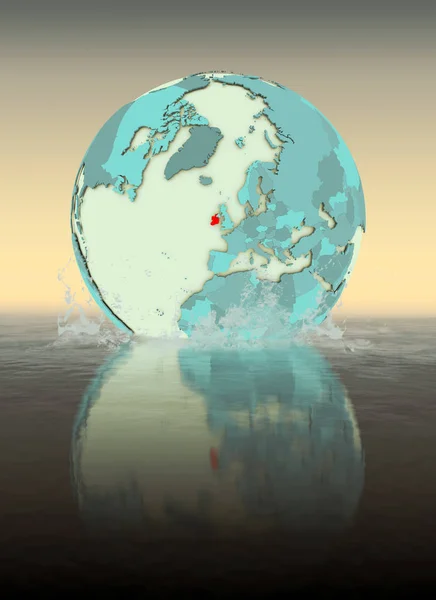 Ireland on globe splashed into the water. 3D illustration.