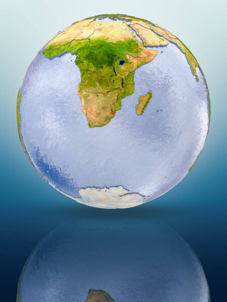 Swaziland In red color on globe reflecting on shiny surface. 3D illustration.