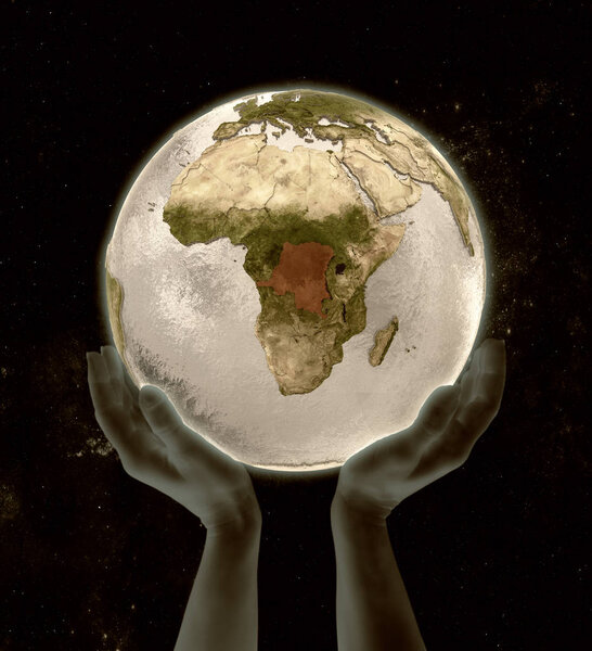 Democratic Republic of Congo on globe in hands in space. 3D illustration.
