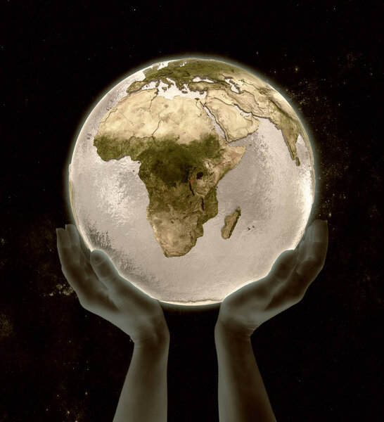 Burundi on globe in hands in space. 3D illustration.