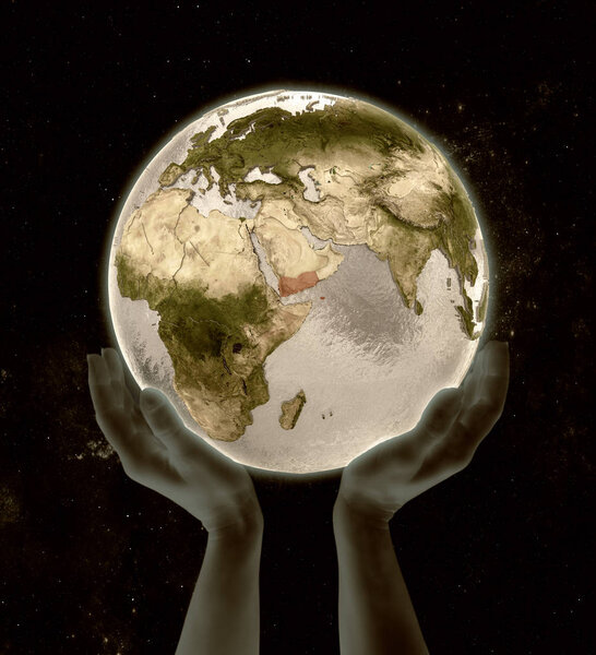 Yemen on globe in hands in space. 3D illustration.