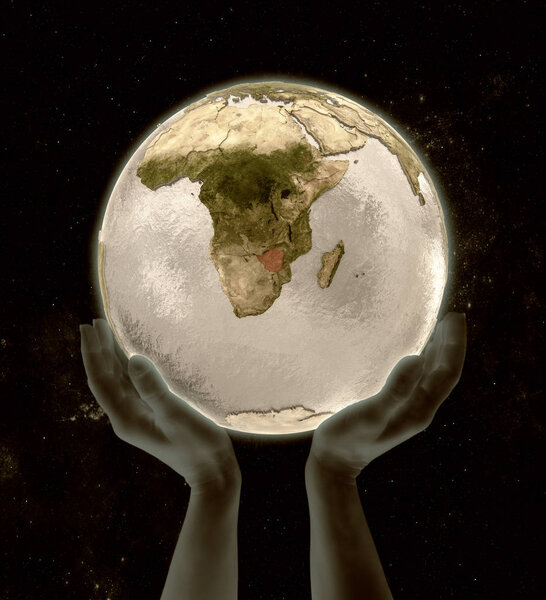 Zimbabwe on globe in hands in space. 3D illustration.