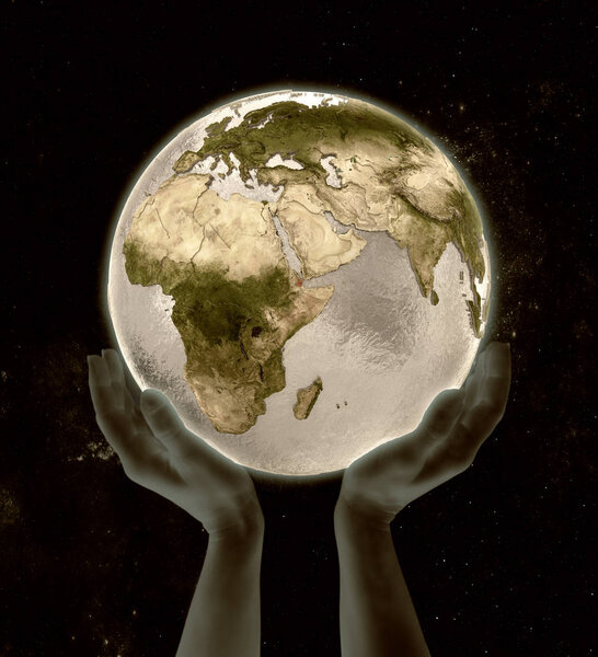 Djibouti on globe in hands in space. 3D illustration.
