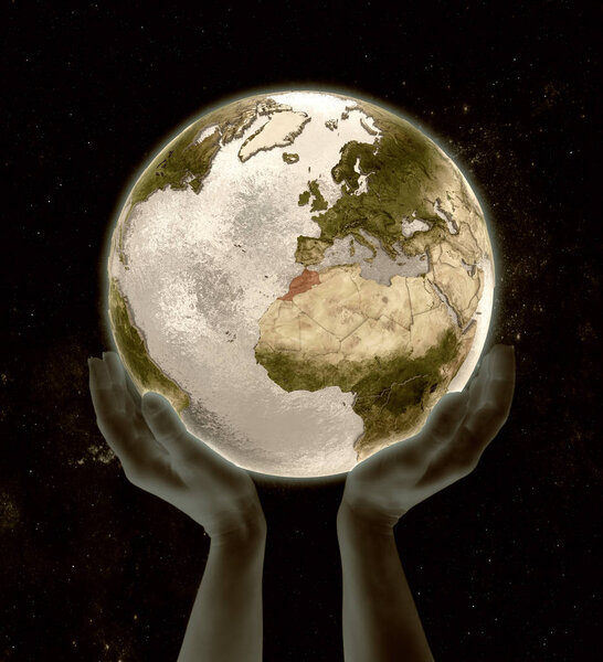 Morocco on globe in hands in space. 3D illustration.