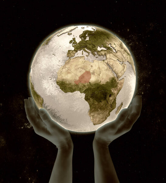 Niger on globe in hands in space. 3D illustration.