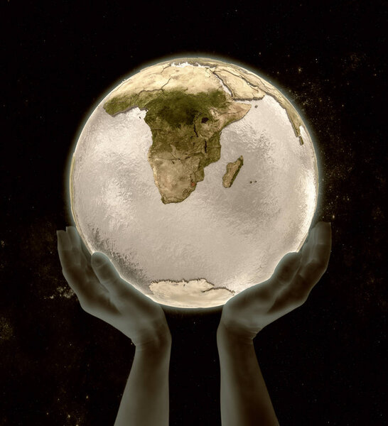 Swaziland on globe in hands in space. 3D illustration.