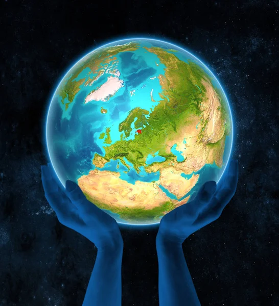 Estonia in red on globe held in hands in space. 3D illustration.