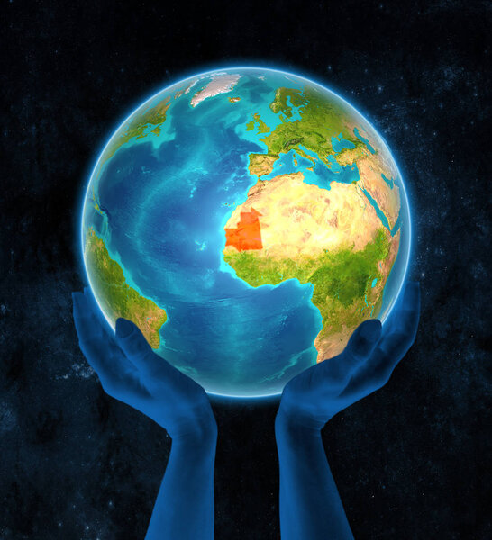 Mauritania in red on globe held in hands in space. 3D illustration.