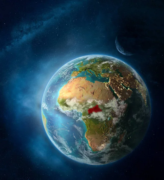 Central Africa from space on Earth surrounded by space with Moon and Milky Way. Detailed planet surface with city lights and clouds. 3D illustration. Elements of this image furnished by NASA.