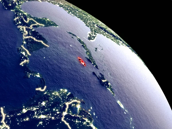 Jamaica at night from orbit. Plastic planet surface with visible city lights. 3D illustration. Elements of this image furnished by NASA.