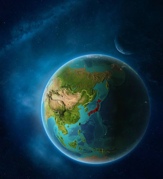Planet Earth with highlighted Japan in space with Moon and Milky Way. Visible city lights and country borders. 3D illustration. Elements of this image furnished by NASA.
