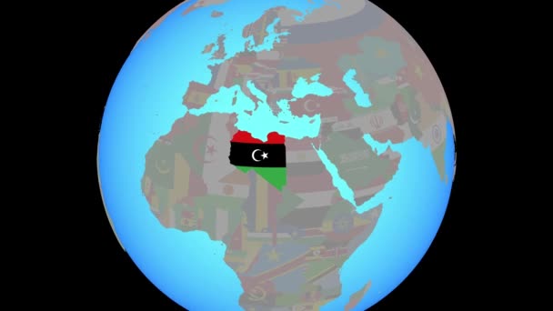 Zooma in till Libyen med flagga på kartan — Stockvideo