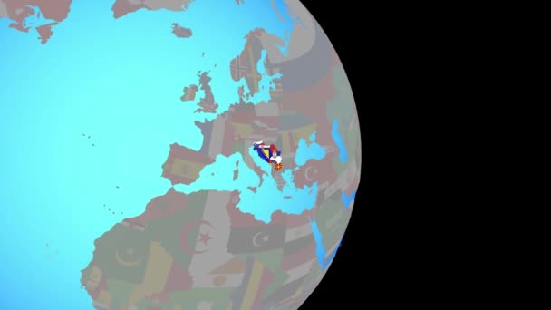 Zoom in op voormalig Joegoslavië met vlaggen op wereldbol — Stockvideo