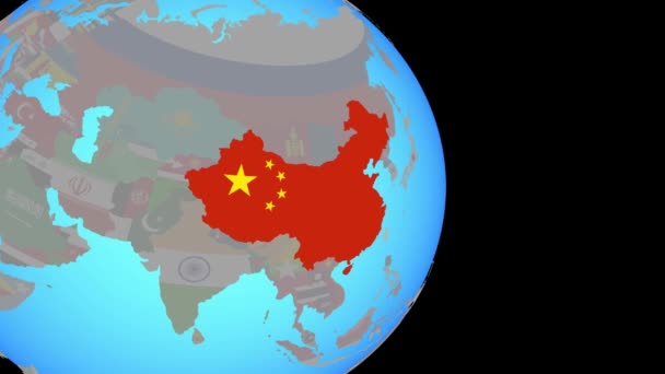 Zoom naar China met vlag op wereldbol — Stockvideo