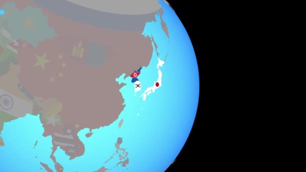Збільшення Японії та Кореї з прапорами на земній кулі — стокове відео