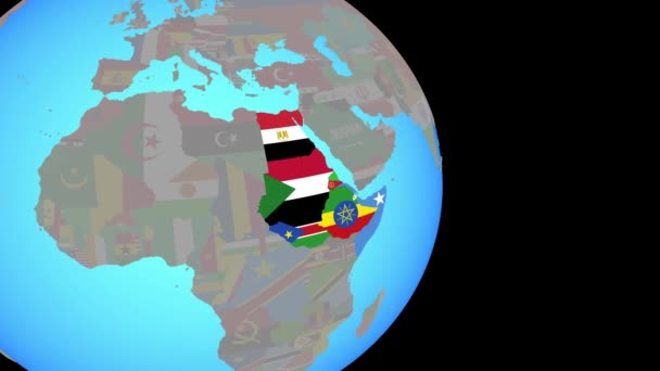 Zoom nach Nordostafrika mit Flaggen auf Globus — Stockvideo