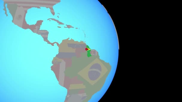 Zoom naar Guyana met vlag op wereldbol — Stockvideo